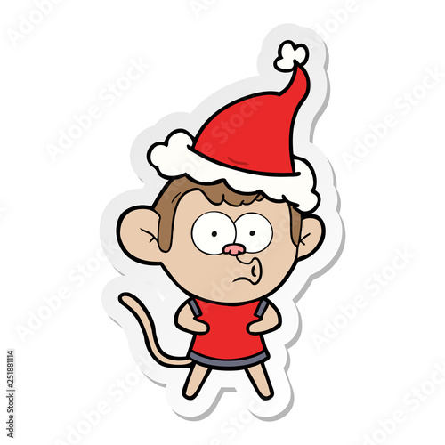 sticker cartoon of a surprised monkey wearing santa hat