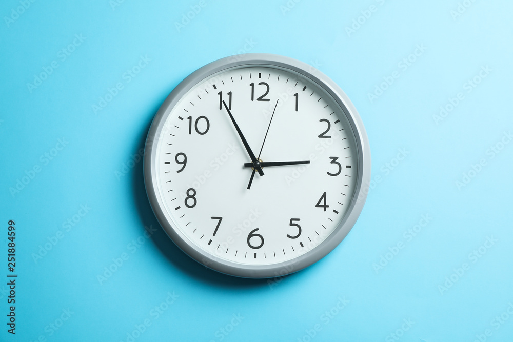 Big beautiful clock on blue background, space for text Big beautiful clock on blue background, space for text