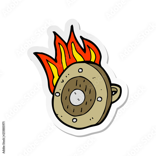 sticker of a cartoon burning shield