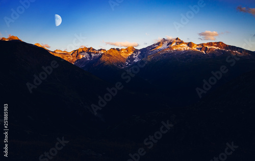 Panorama of snow ridge in twilight. Location place Swiss alps, Grimsel pass.