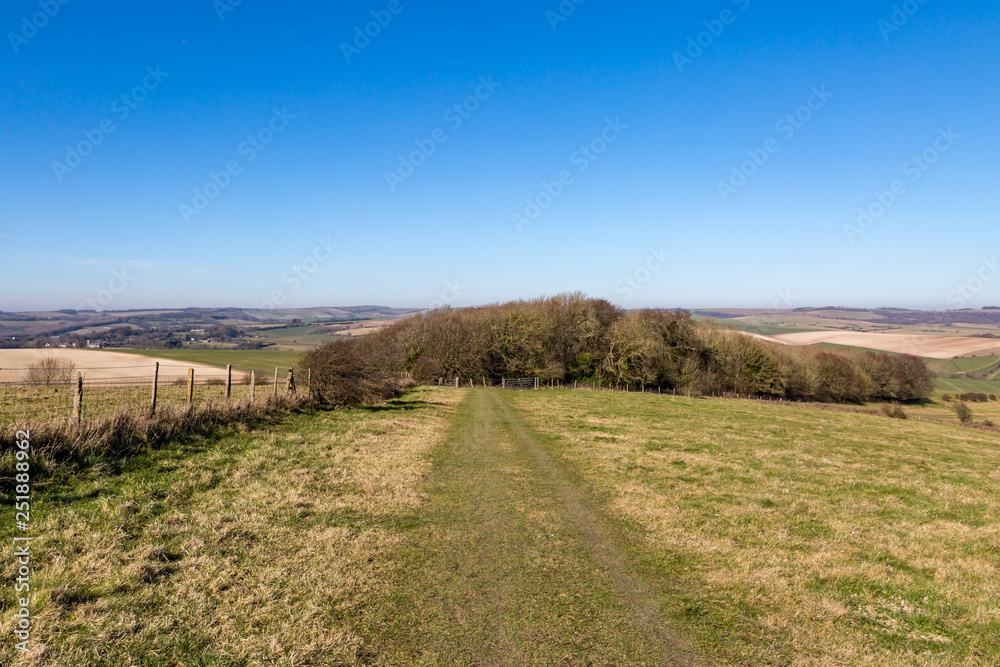 A pathway through fields, in the South Downs in Sussex