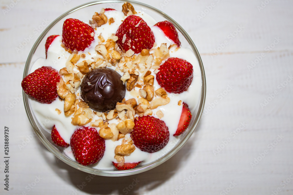 white ice cream with strawberries in a plate white ice cream with strawberries in a plate