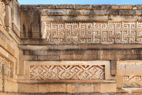 Elaborate fretwork found in old ruins in Oaxaca, Mexico. Intricate stone detail found in the archaeological site of Mitla photo