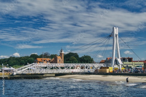 Obraz na płótnie view of the Ustka coast and drawbridge, buildings and beach w salonie