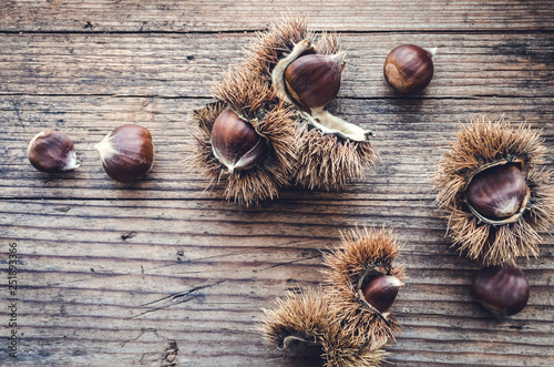 Chestnuts on wooden background