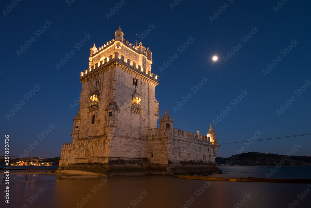 Belém Tower (Torre de Belém) a mediaeval portuguese fortification from the 16th century in Lisbon during blue hour. Portugal tourism and destination