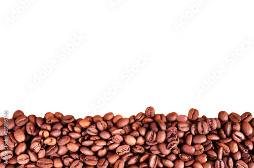 Coffee beans at border of image with copy space for text. Coffee background or texture concept. Coffee beans on white background.