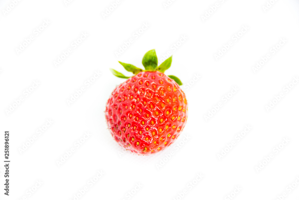 One red strawberry with leaves on white background