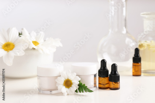 Skin care products  ingredients and laboratory glassware on table. Dermatology research
