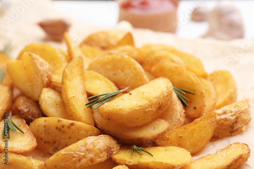 Closeup view of delicious baked potato wedges