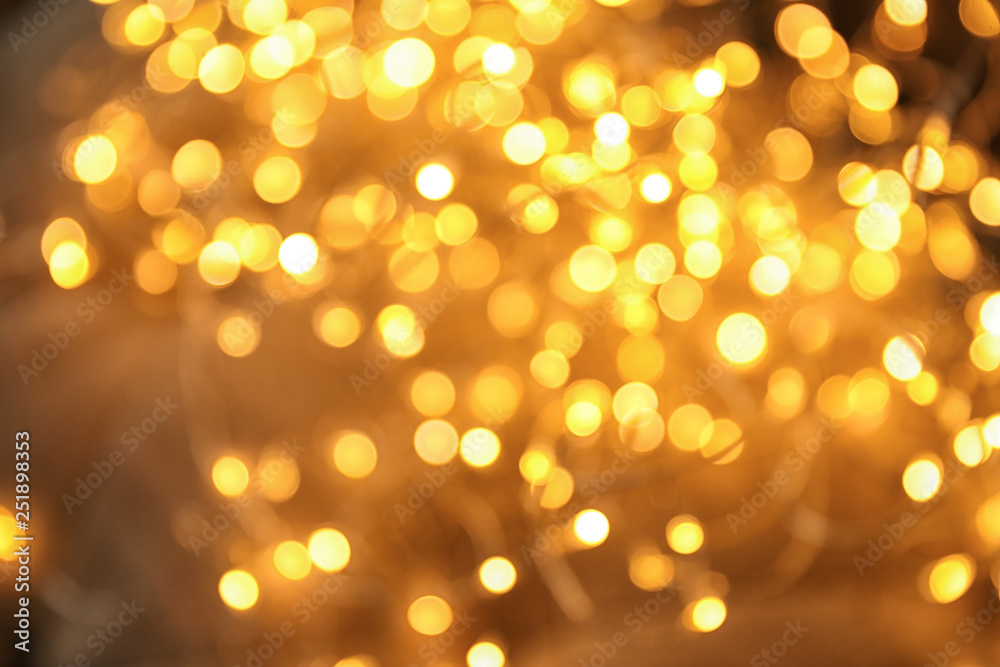 Gold glitter with bokeh effect on dark background Gold glitter with bokeh effect on dark background
