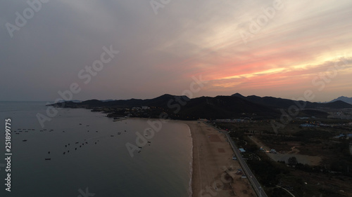 sunset on the beach with mountain views