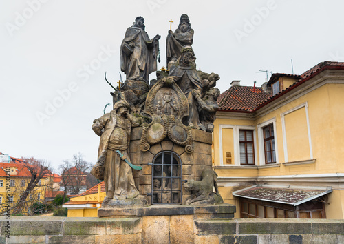 Prague, Czech Republic. Statues of Saints John of Matha, Felix of Valois, and Ivan on the Charles Bridge. The sculpture was designed in 1714. The base depicts a cave in which three chained Christians 