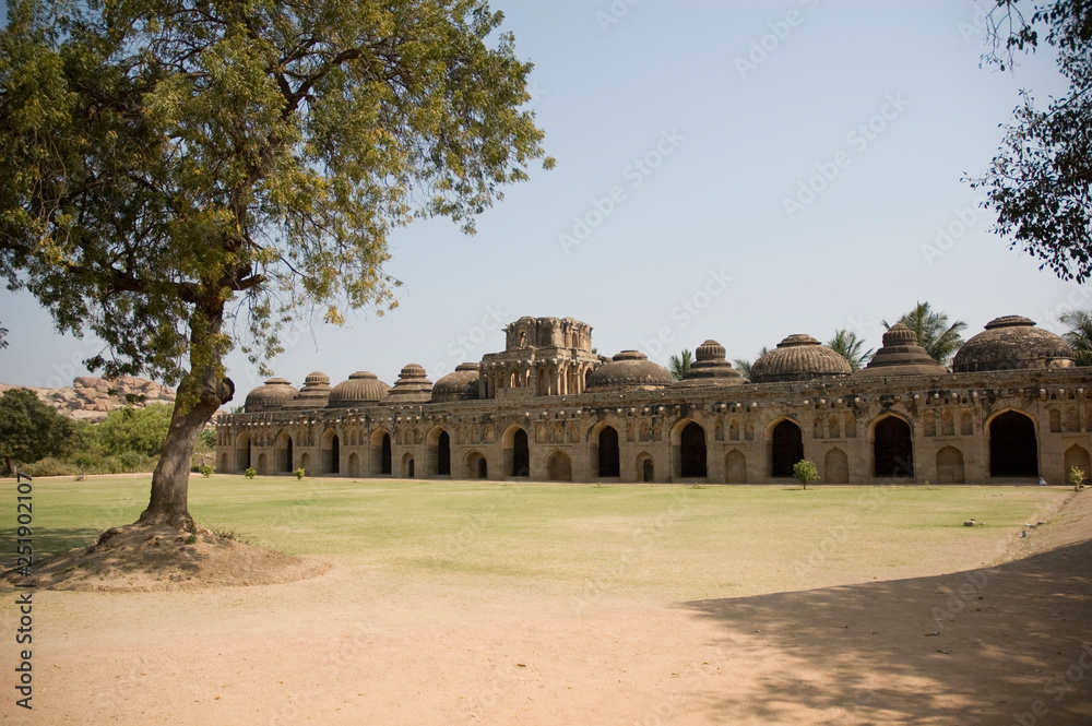 The Elephant Stable at Hampi in Karnataka, India. Built in the 14th century, it housed the King's Elephants. It is a UNESCO Heritage Site. Pictured here is the Stable and the huge lawn in front