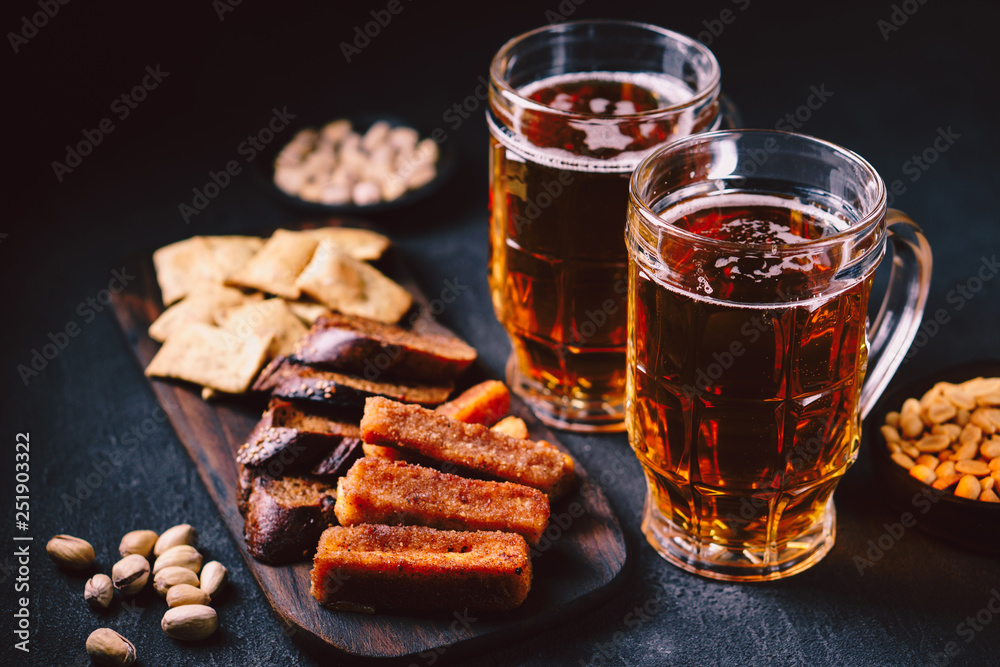 beer and snacks. bar table. restaurant, pub, food concept. craft lager drink, salted nuts and breaded fried cheese. friday party atmosphere, craft brewery background beer and snacks. bar table. restaurant, pub, food concept. craft lager drink, salted nuts and breaded fried cheese. friday party atmosphere, craft brewery background