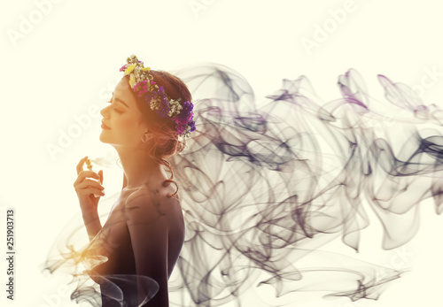 Charming woman spray perfume on her body. She has sexual attraction.