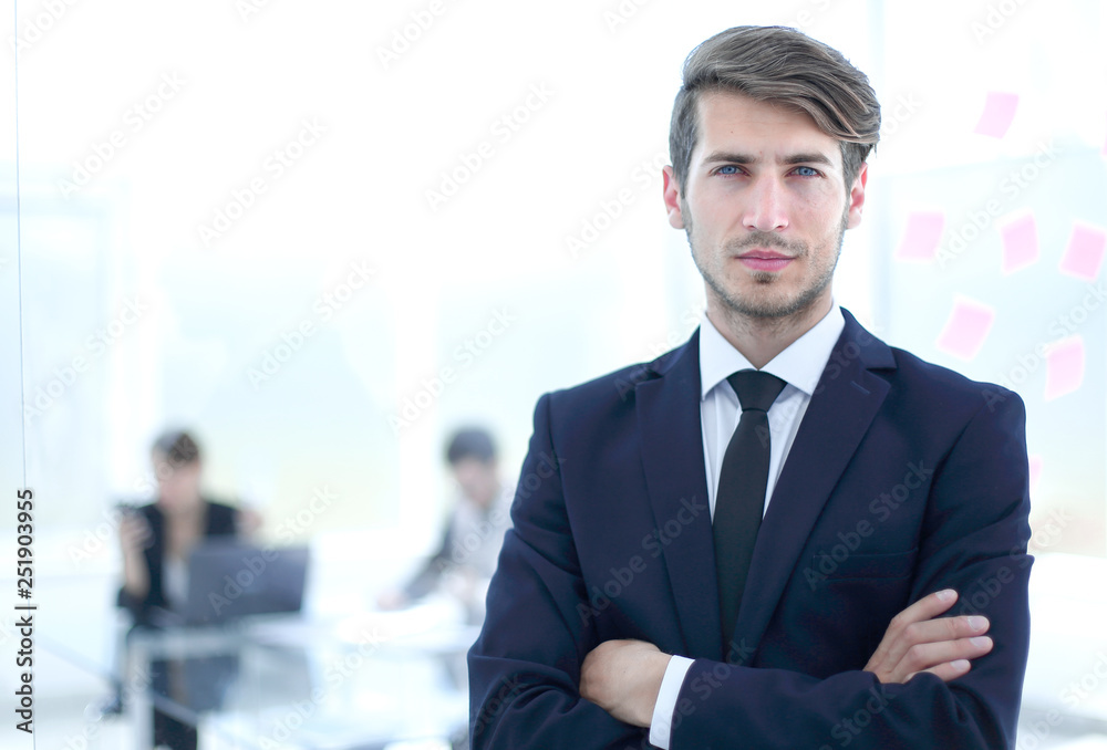 successful businessman on the background of the modern office successful businessman on the background of the modern office