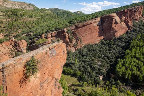 Martin river cultural park - escarpment of red sandstone next to Penarroyas village (Montalban), province of Teruel, Aragon, Spain photo