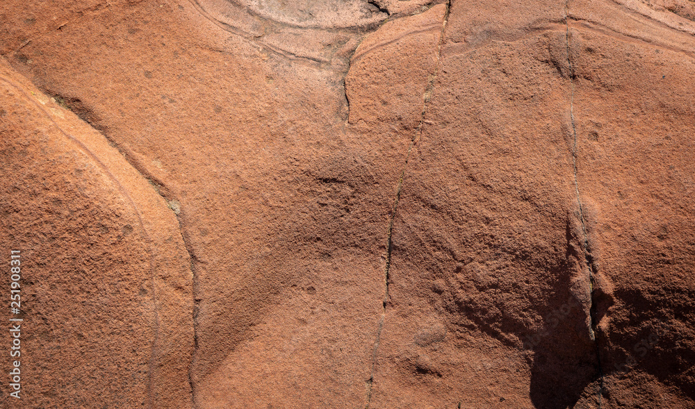Fototapeta premium red sandstone background with curious abstract shapes