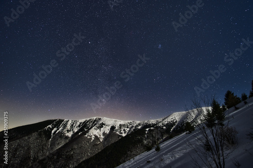Konstfotografi Winter snow covered crest of Mala Fatra mountains Slovakia and starry night sky