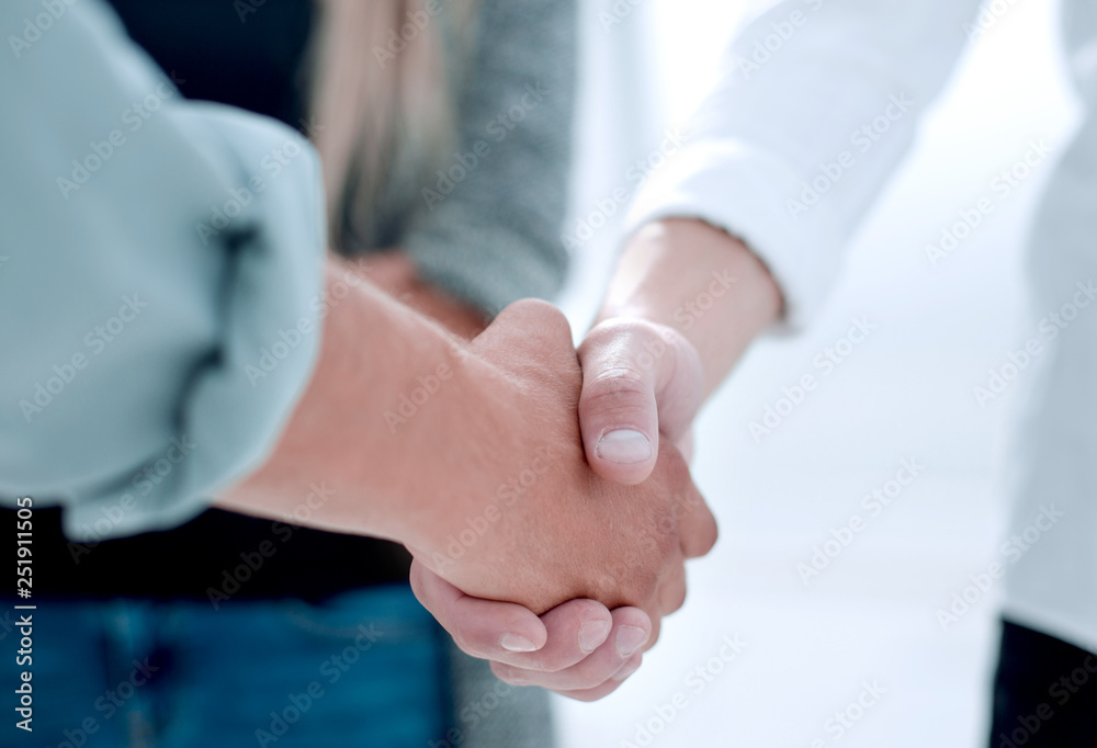 Close-up of business partners shaking hands in a meeting Close-up of business partners shaking hands in a meeting