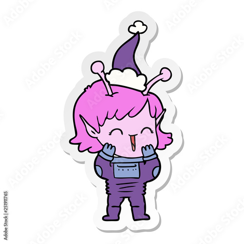sticker cartoon of a alien girl giggling wearing santa hat
