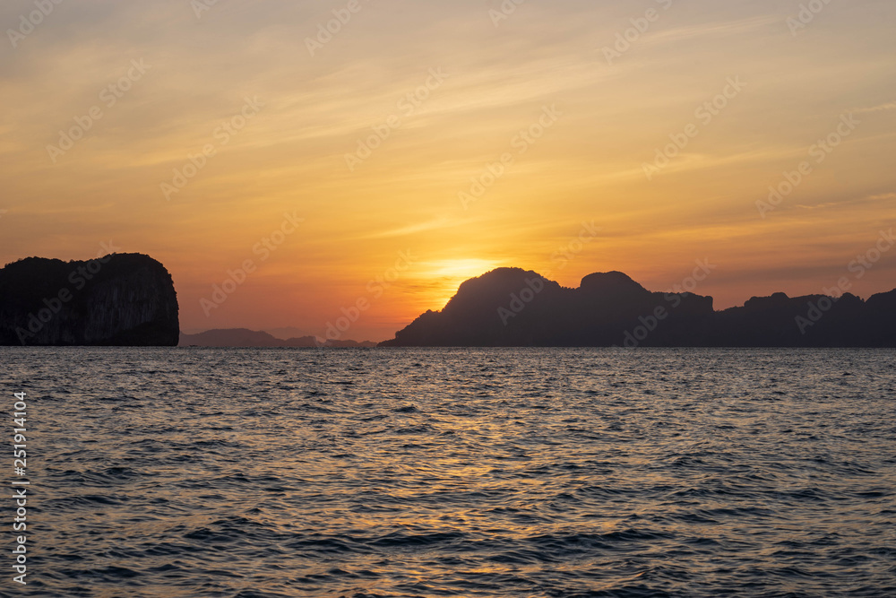 Sunrise view from Ko Ngai island, Trang Province, Southern Thailand with beautiful sea water, twilight sky.