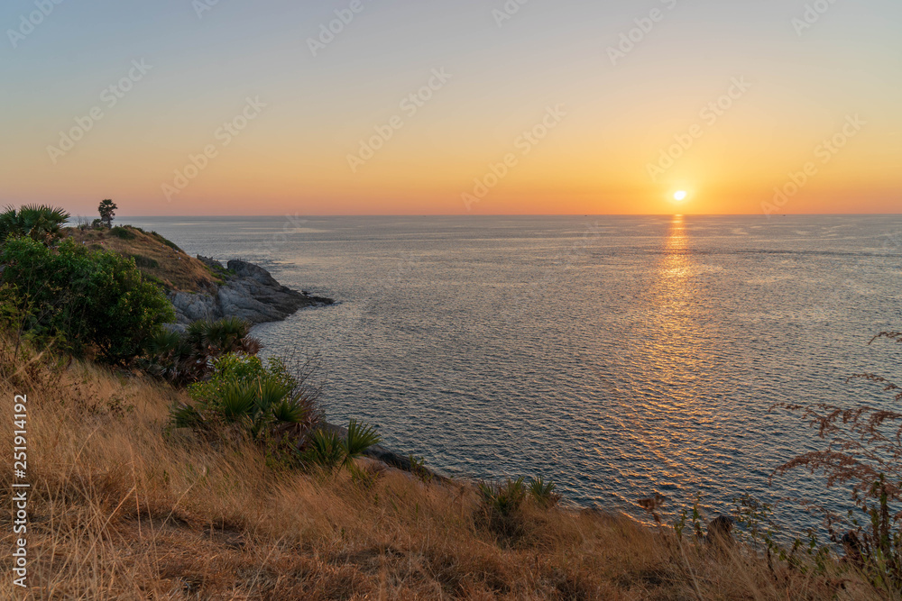 Sunrise view from Promthep cape, Phuket island, Southern Thailand with beautiful sea water, twilight sky.