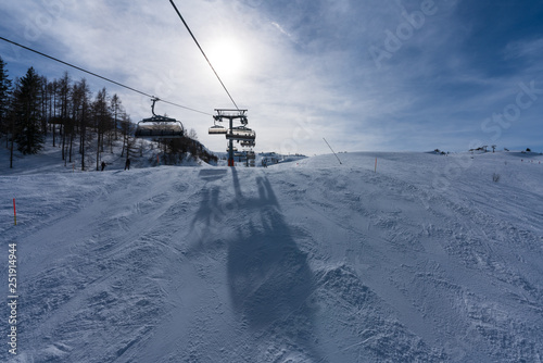 Aussicht von Waidring Steinplatte auf Winterlandschaft mit Schipiste photo