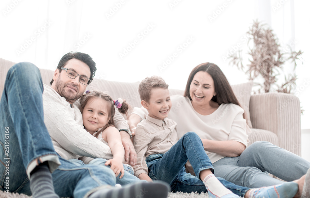happy family rests in the living room on a free evening