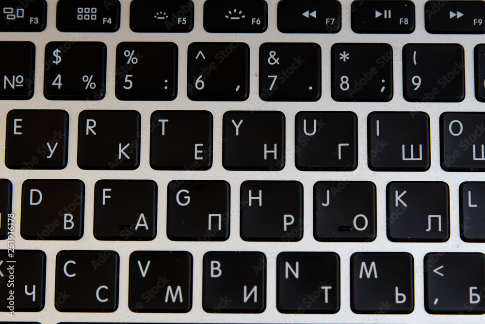 Close up of keyboard of a modern laptop. Enter button Close up of keyboard of a modern laptop. Enter button