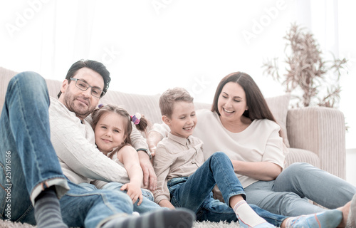 happy family rests in the living room on a free evening
