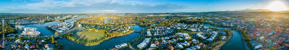 Wide aerial panorama of beautiful sunset over luxury suburb on the Gold Coast, Queensland, Australia
