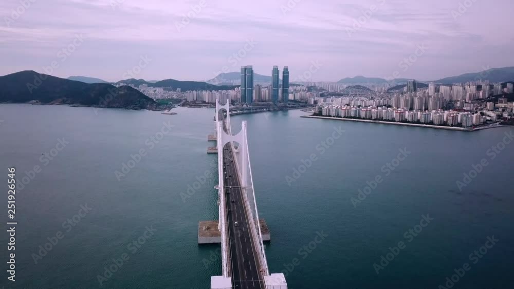 Gwangan Bridge and Haeundae aerial view at Sunrise, Busan, South Korea.