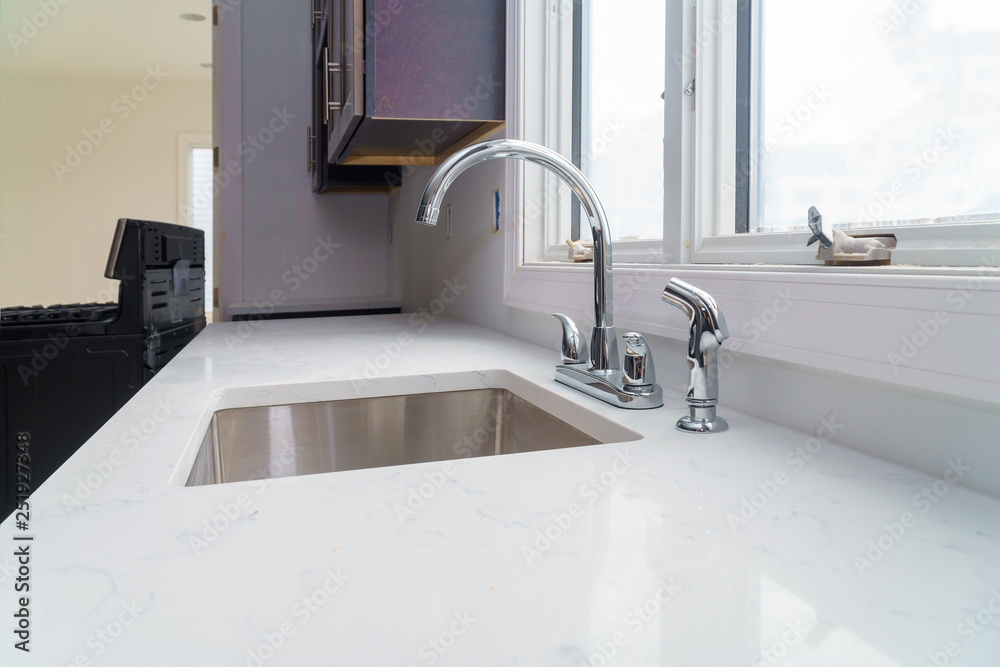 Faucet and kitchen sink with brick wall Faucet and kitchen sink with brick wall