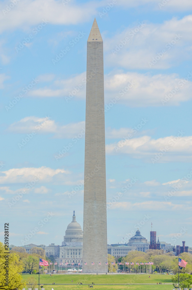 Washington Monument under blue skies with many clouds