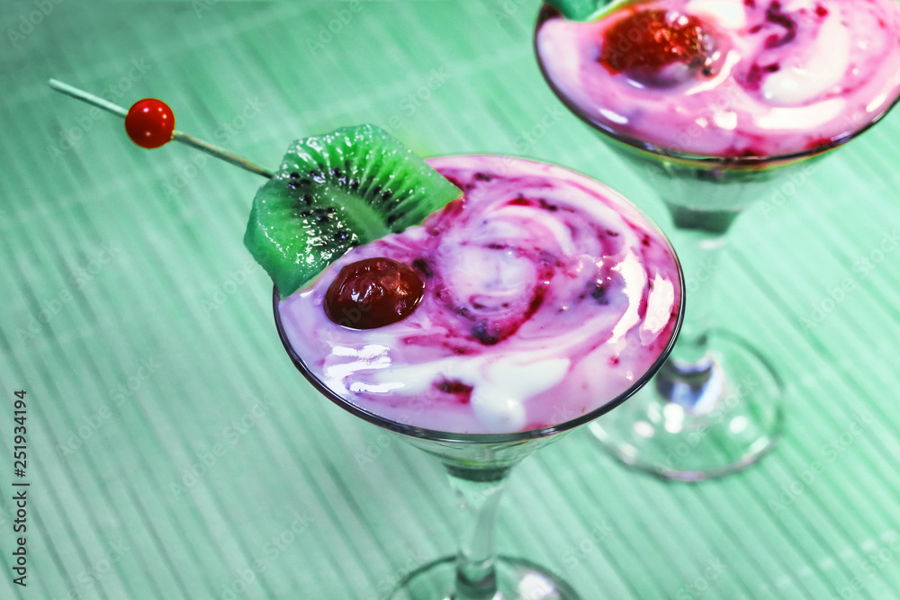 milk yogurt with berry jam.   in martini glasses.  frozen cherries.