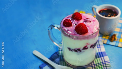 milk yogurt with berry jam. frozen cherries.