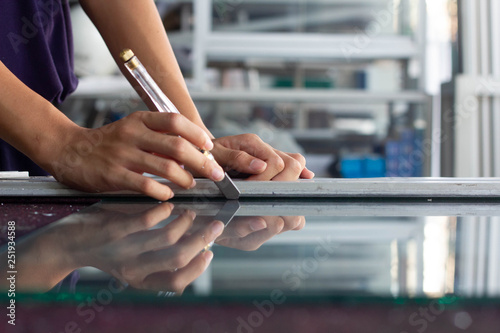 Technicians use glass cutting tools.