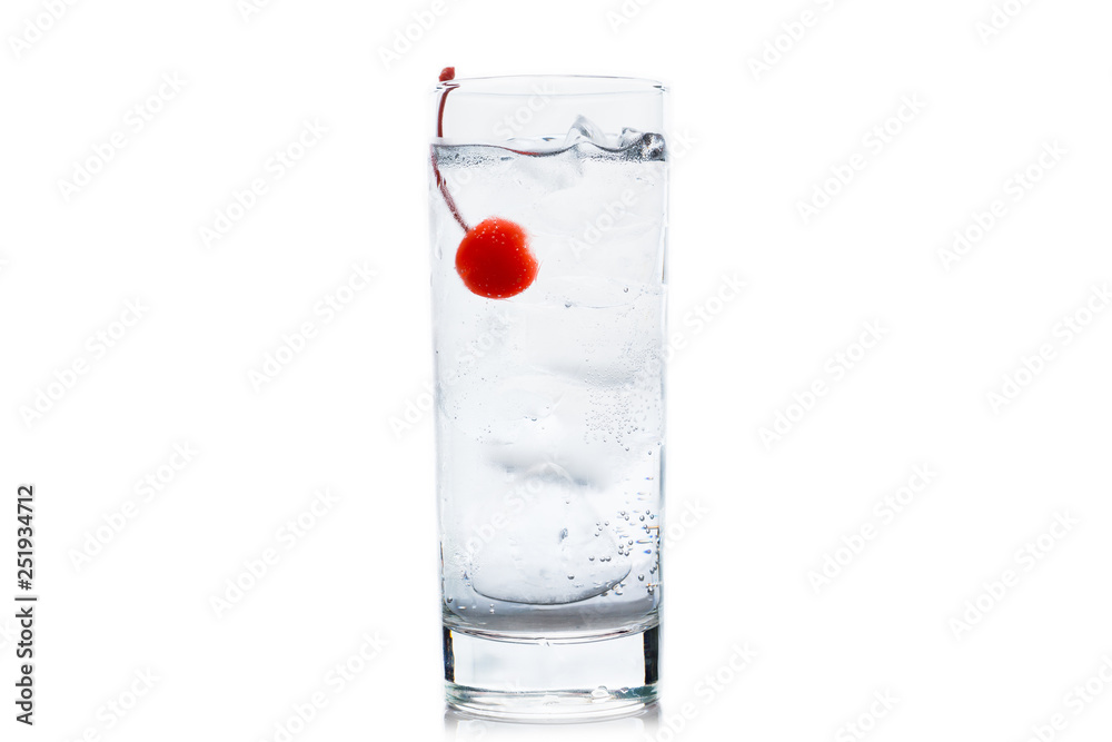 Bitter transparent cocktail with cocktail cherry isolated on white background. Selective focus. Shallow depth of field. Bitter transparent cocktail with cocktail cherry isolated on white background. Selective focus. Shallow depth of field.