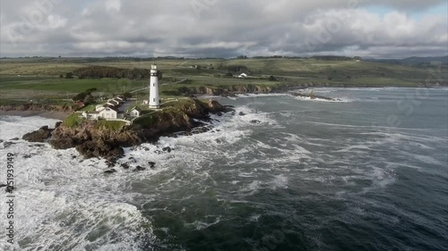Aerial shot  of the lighthouse on the coast in the pacific ocean, very cinematic