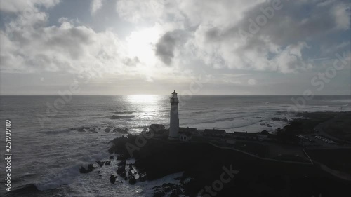 Aerial shot  of the lighthouse on the coast in the pacific ocean, very cinematic
