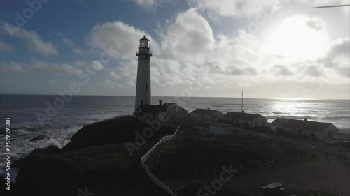 Aerial shot  of the lighthouse on the coast in the pacific ocean, very cinematic