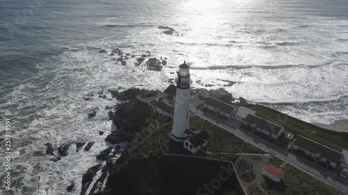 Aerial shot  of the lighthouse on the coast in the pacific ocean, very cinematic