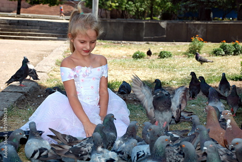 little girl and pigeons