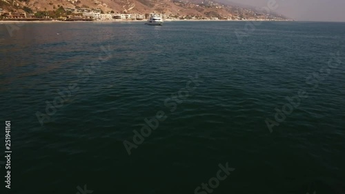 yacht in the ocean, aerial shot in malibu, california 