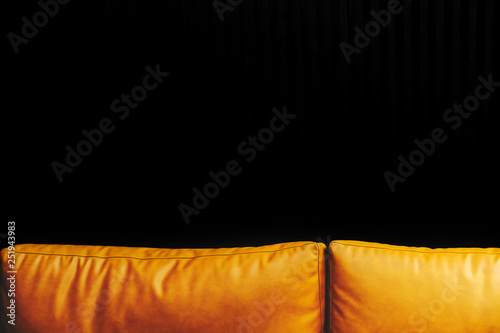 Mustard leather cushions and black background