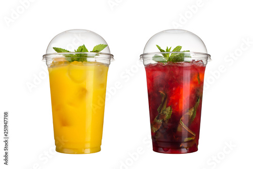 Delicious fruit smoothies in plastic cups, on a white background. Two cocktails with pineapple flavor and berry mojito.