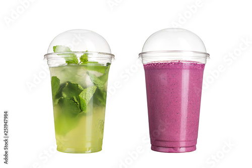 Delicious fruit smoothies in plastic cups, on a white background. Two cocktails with a taste of mojito and wild berries.