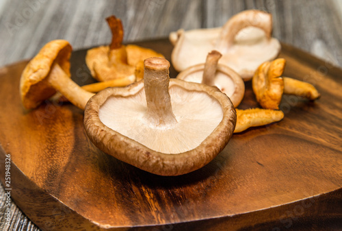 Shiitake mushrooms on wooden cutting board